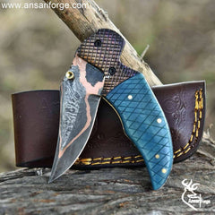 Hand forged copper Damascus pocket knife.