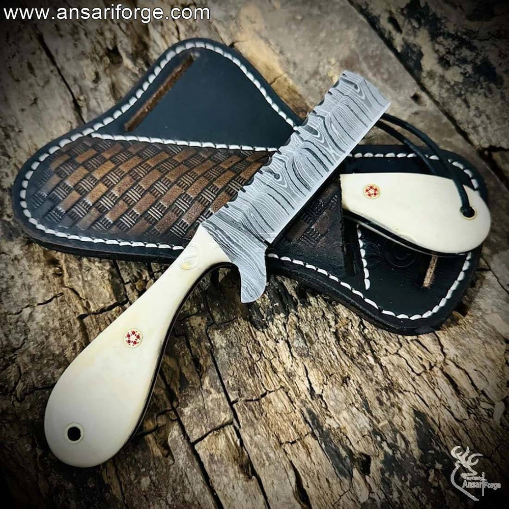 Handmade Damascus Bull Cutter Knife with twist pattern blade and camel bone handle.