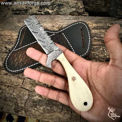 High-carbon 1095 & 15n20 Damascus steel Bull Cutter Knife blade showing detailed twist pattern.