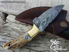 Real Damascus steel Every day carry knife, compact drop point blade & brass bolsters.