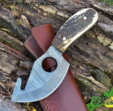 Hand-forged Damascus gut hook skinning knife with stag antler handle and leather sheath.