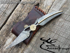 Handmade Damascus Pocket Knife in custom cowhide leather sheath, highlighting its elegant design