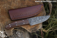 Handmade Damascus steel hunting deer skinning knife with leather sheath .