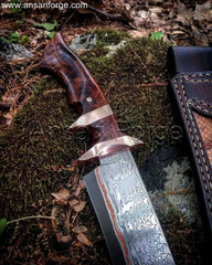 Hand-forged Copper Damascus Knife with Raindrop Pattern, Clip Point Blade, Burl Wood Handle, and Leather Sheath