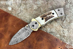 Custom made Damascus steel pocket knife with stag handle