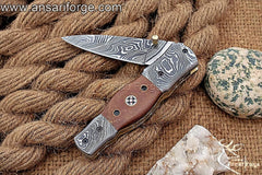 Damascus steel pocket knife with leather pouch