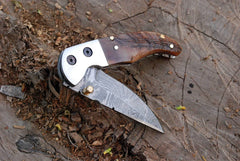 Folding knife open view showing 7.0 inch length.