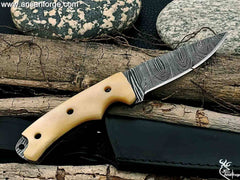 Damascus steel hunting knife with a camel bone handle.