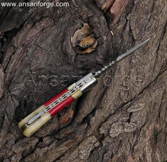 Handcrafted Damascus folding pocket knife with a unique twist pattern Damascus steel blade, camel bone and red pakkawood handle, and a brown cowhide leather sheath. This EDC knife is 7 inches long when opened.