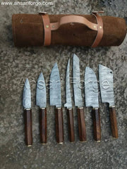 Octagonal Japanese "Wa" style rosewood handles on Damascus steel knives, emphasizing comfort and control.