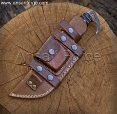 Tracker Knife securely placed in its high-quality cowhide leather sheath, ready for easy horizontal draw scout carry.