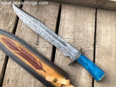 Feather Damascus Bowie Knife with beautiful feather pattern Damascus steel blade, camel bone handle, and cowhide leather sheath featuring scrimshaw artwork.