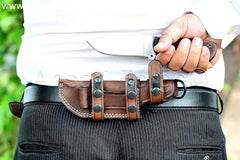 Handmade hunting knife with horizontal carry sheath.