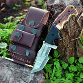 Damascus folding tracker knife with stag antler handle.