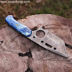 Honoo Damascus steel tanto blade with sharp point and layered pattern.