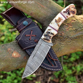 Handmade Damascus Hunting Knife with Leather Sheath. Fixed blade for versatile use in hunting and field dressing. Ram horn handle for secure grip.