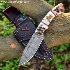 Handmade Damascus Hunting Knife with Leather Sheath. Fixed blade for versatile use in hunting and field dressing. Ram horn handle for secure grip.