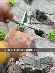 Handcrafted high carbon steel fixed blade hunting knife with stag/deer antler handle and rosewood bolsters, displayed in a cowhide leather sheath.