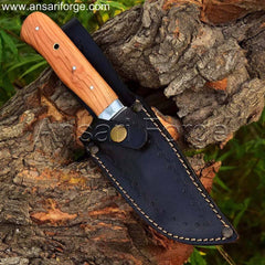 Handcrafted fixed blade hunting knife with drop point D2 steel blade, olive wood handle, and leather sheath. Perfect for camping, hiking, and wilderness adventures.