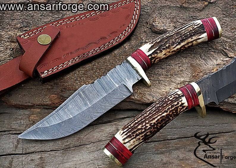 Damascus Steel Stag Handle Knife - Hand-forged hunting knife with twisted Damascus pattern blade leather sheath.