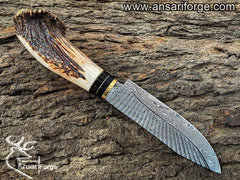 Hand-forged Damascus steel blade with Rain Drop pattern.