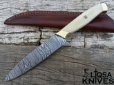 A beautifully crafted Handmade Damascus Chefs Knife with a full tang construction, brass bolsters, and a comfortable camel bone handle, ready to tackle any culinary challenge.