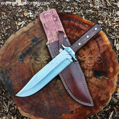 Red Dead Redemption 2 Bowie Knife lying on a woods, sunlight glinting off the blade.