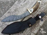 Best Kukri Knife For Sale: Original Damascus Kukri Knife With Sheath. Full view showing Stag Antler handle and Nepali curved blade.