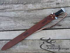 Ansari Forge handcrafted Viking sword Damascus blade in leather sheath.