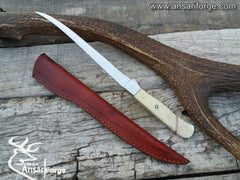 Ansari Forge Handmade Fillet Knife, showing the knife with its leather sheath, highlighting the blade's sharpness, the handle's comfortable grip, and the sheath's durability.