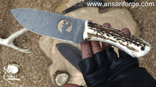 Full tang drop point hunting knife with sheath. High-quality leather sheath for the Ansari Forge Demascus knife.
