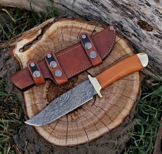 Hand-forged twist Damascus steel hunting knife with an 11-inch fixed blade, leather sheath, and a leather-wrapped wood handle.