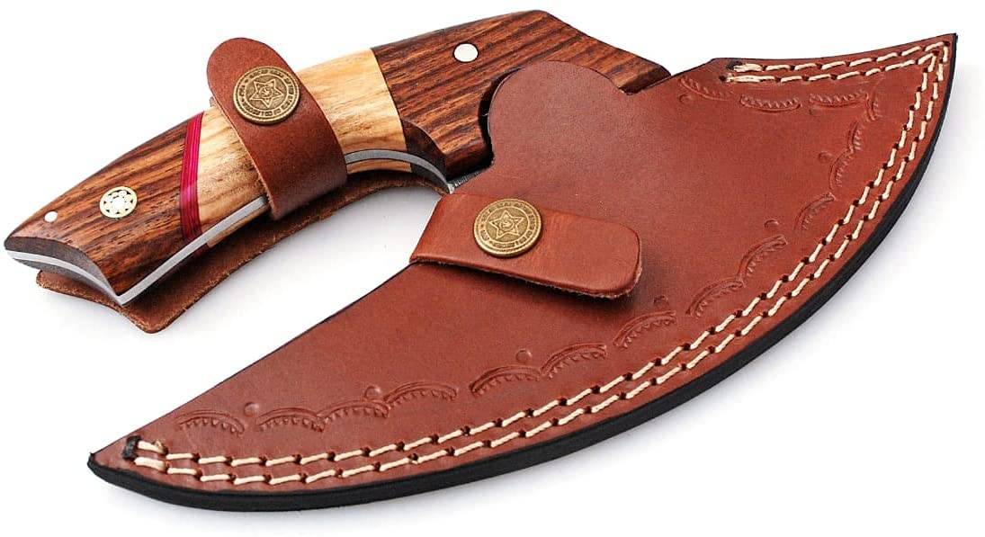 Close-up of Alaskan Ulu Knife’s finger hole grip and handmade leather sheath.