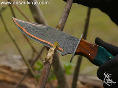 Copper Damascus hunting knife ready for adventure.
