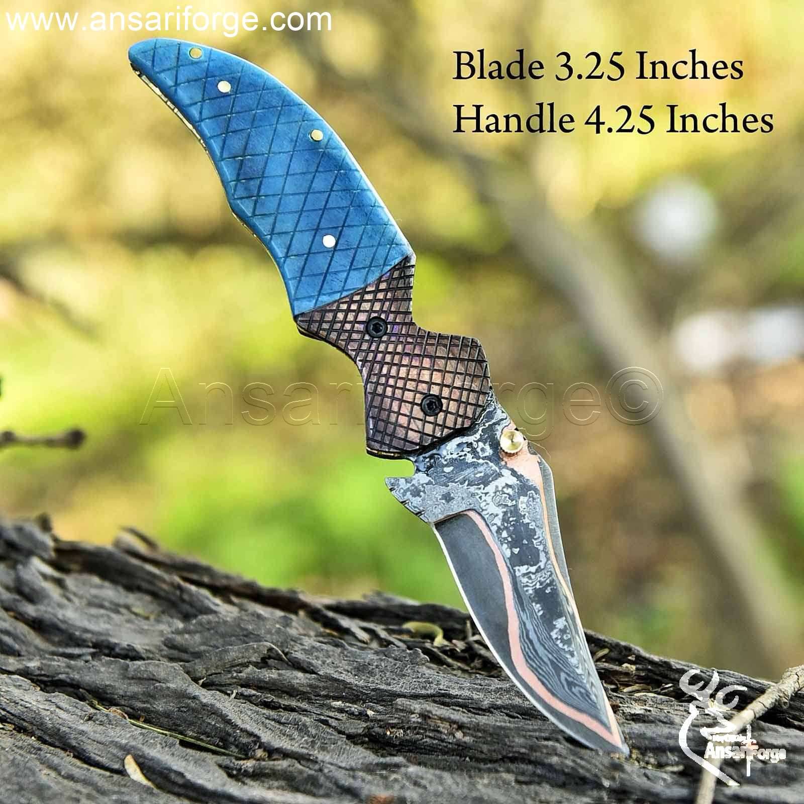 Copper Damascus folding knife with bone handle.