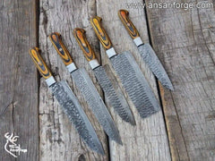 Close-up of razor-sharp Damascus steel knife blade showing unique twist pattern – 1095 high carbon and 15N20 nickel.