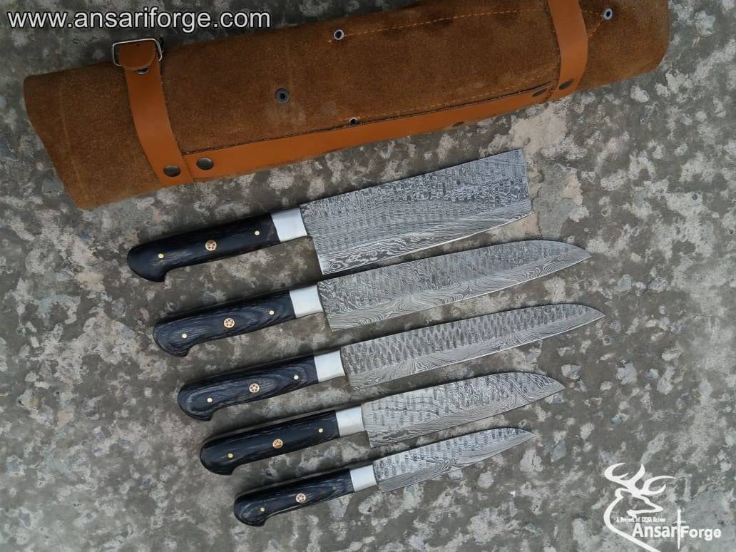 Five Damascus steel kitchen knives with pakkawood handles displayed in a luxurious leather roll bag.