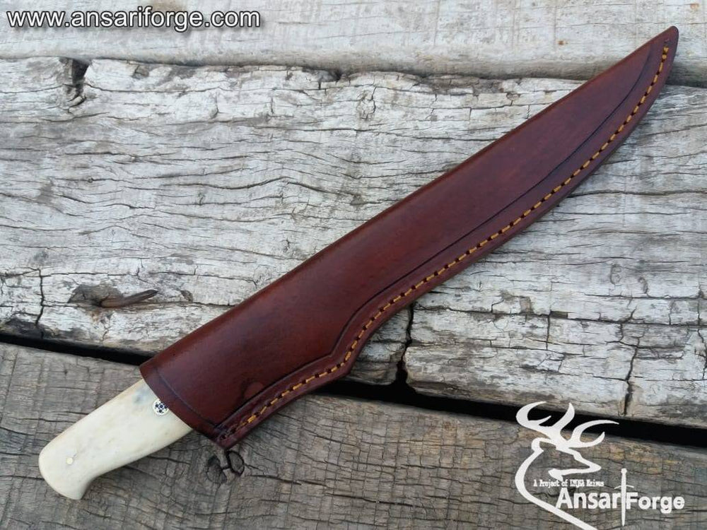 Fillet knife in brown leather sheath.