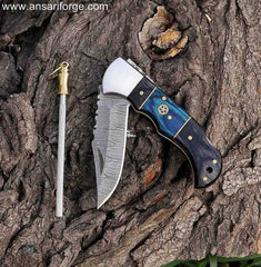 Sharp and strong Damascus pocket knife for everyday carry. Includes sharpener and leather pouch.