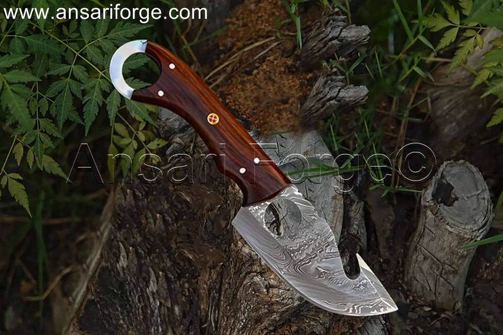 Apex Skinner handcrafted Damascus steel fixed blade best deer skinning knife with finger hole grip and rosewood handle.