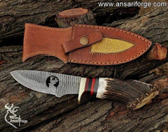 624-layer Damascus hunting knife with stag antler handle.