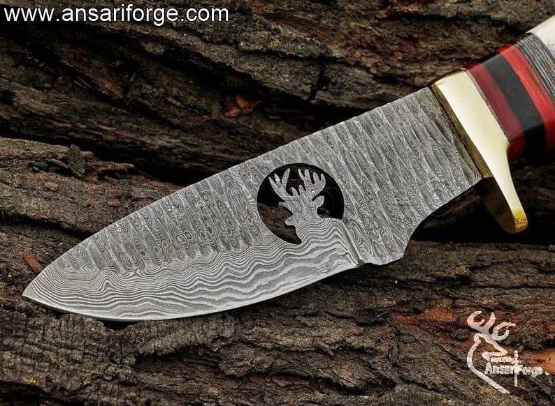 Hand-forged Damascus steel knife hunting blade with twist pattern.