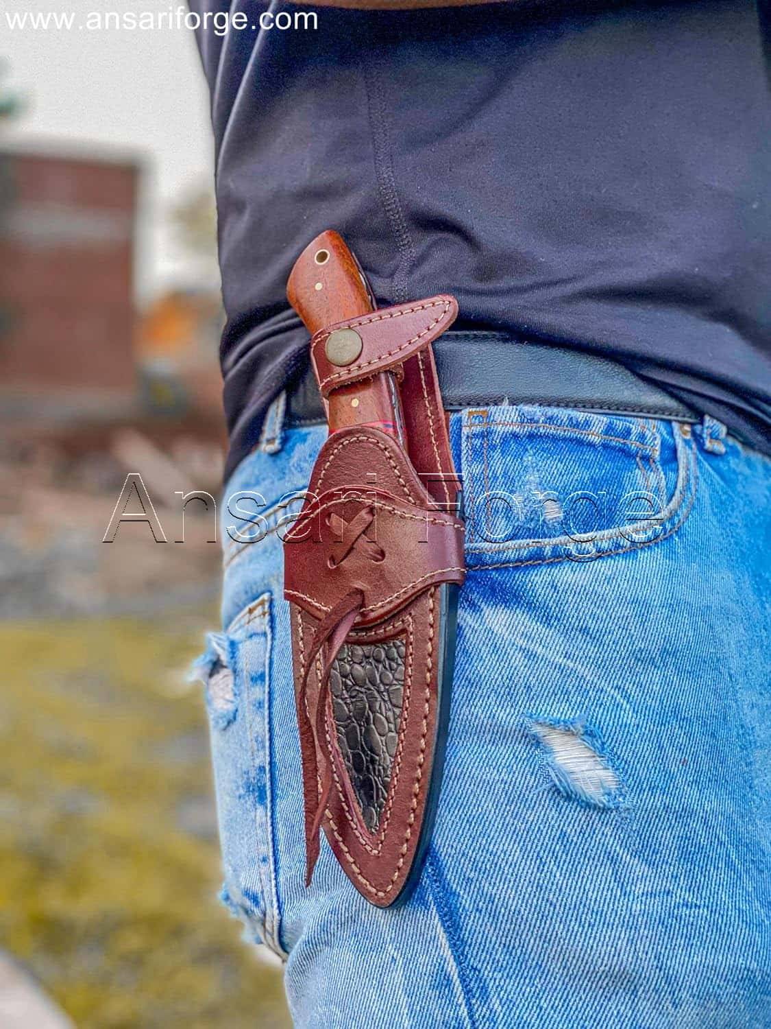 A Camp guy hanging Damascus Camping knife in his belt