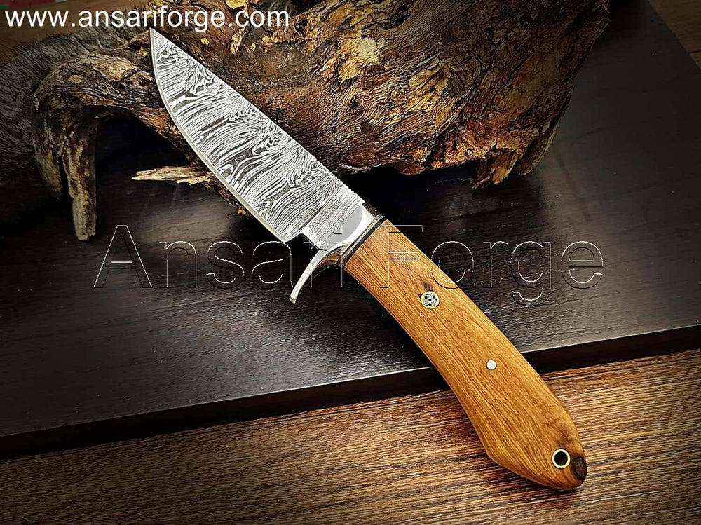 Hand-forged Damascus steel knife blade showcasing unique fire pattern.