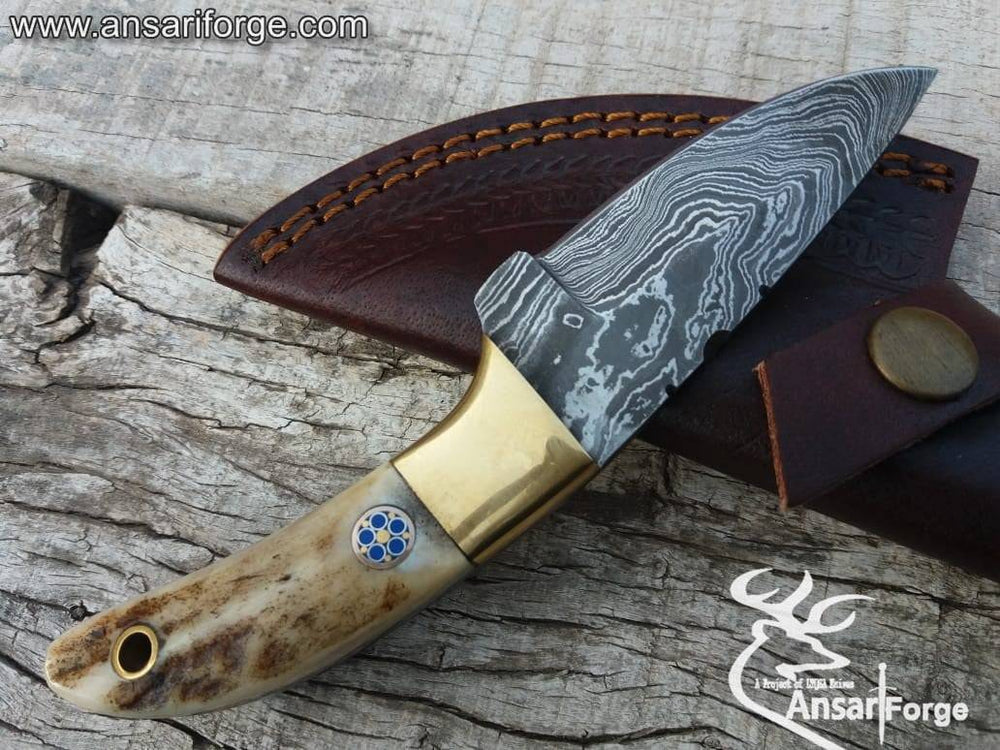 Real Damascus steel Every day carry knife, compact drop point blade & brass bolsters.