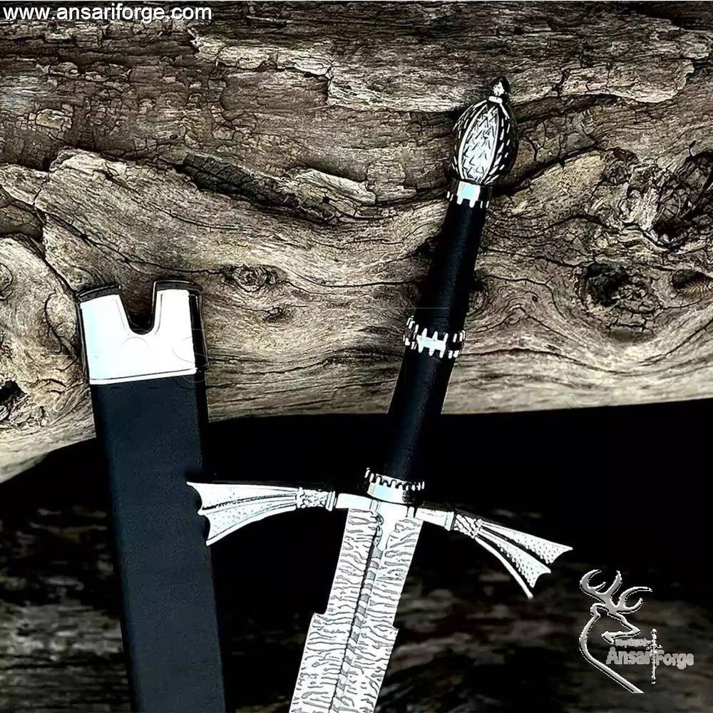 Detail of the Zinc Alloy pommel with beautiful art work and the wings-type hand guard on the Dark Sister Medieval sword.