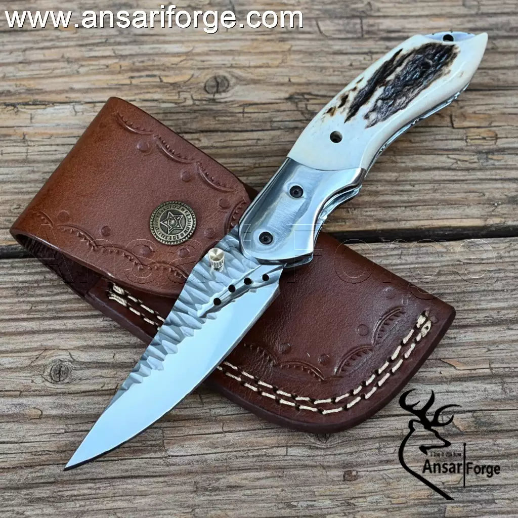 Hand forged 5160 steel folding utility knife with stag antler handle.