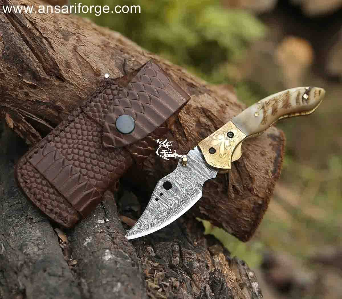 Handmade Damascus pocket knife with engraved bolsters and ram horn handle. ansariforge.com