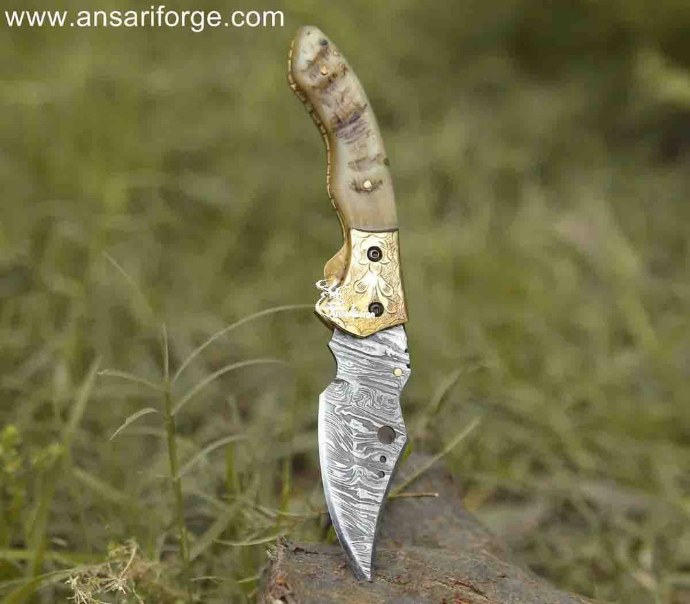 Versatile Custom handmadeDamascus pocket knife with engraved bolsters and ram horn handle