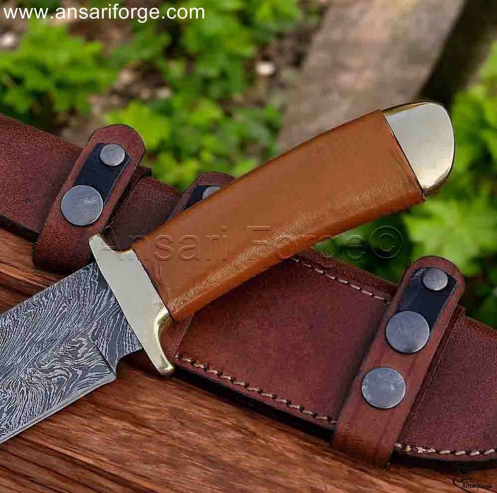 Bronze hilt & pommel of hunting knife with leather wrapped handle.